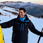 Networking Event**

A friendly ski instructor, fully clothed in professional winter gear, at an après-ski event in the Serra da Estrela mountains. He is engaging in conversation with potential clients, smiling and gesturing towards the slopes in the background. Warm lighting, safe for work, appropriate attire, family-friendly, professional setting, perfect anatomy, natural proportions.

**